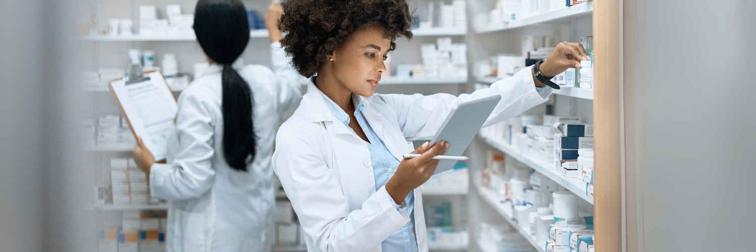 A healthcare technician sorts medications in a pharmacy