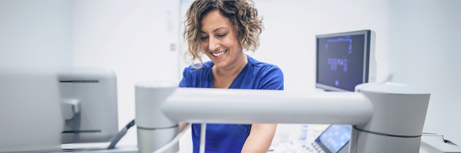 A healthcare technician works with lab equipment